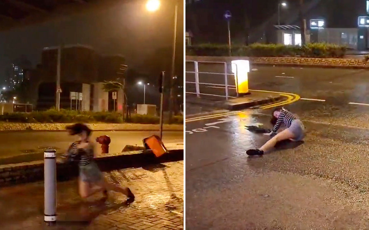 Video |  Super Typhoon Saola drags a woman through the streets of Hong Kong