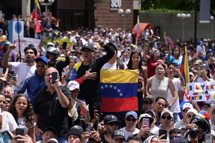 People gather to protest against the election results that gave Venezuelan President Nicolas Maduro a third term in office in Caracas, Venezuela.