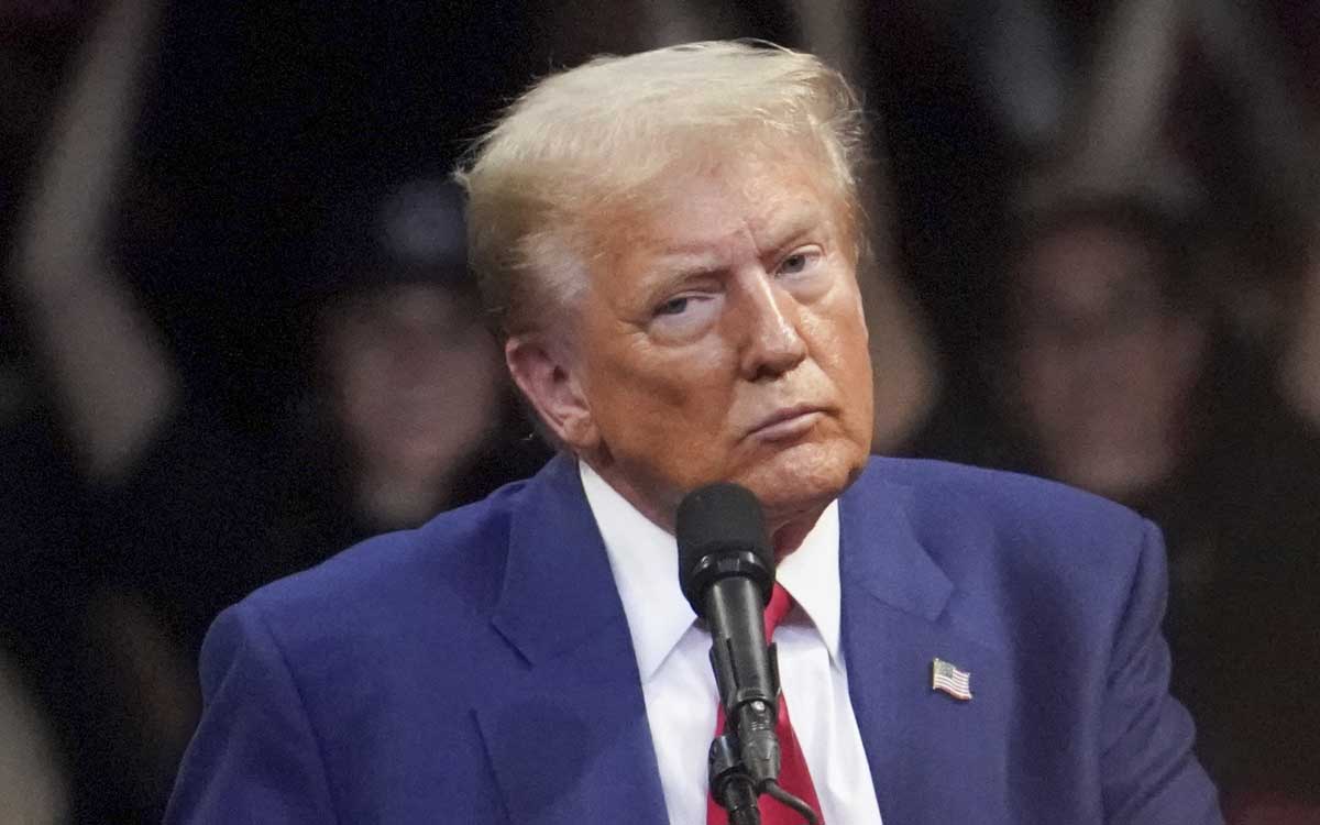 Armed man arrested outside Trump rally; denies intent to attack the candidate