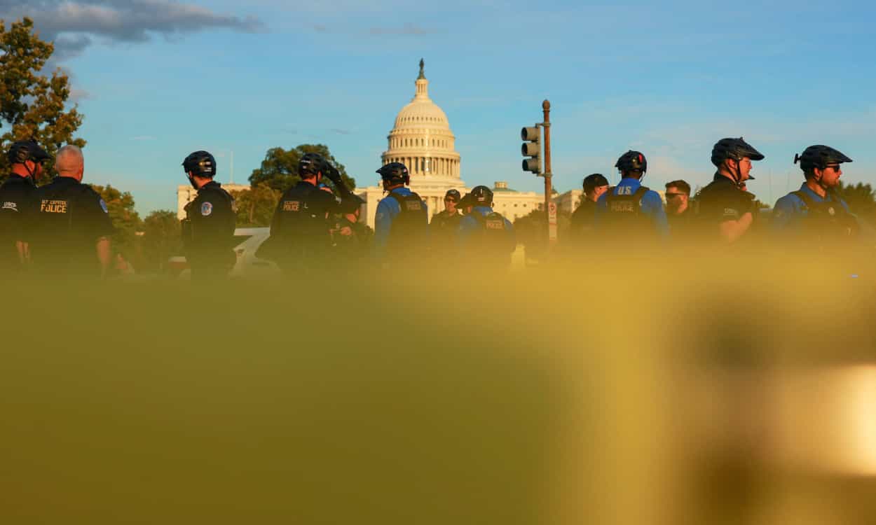 A man with a torch and a flare gun is arrested at the Capitol.